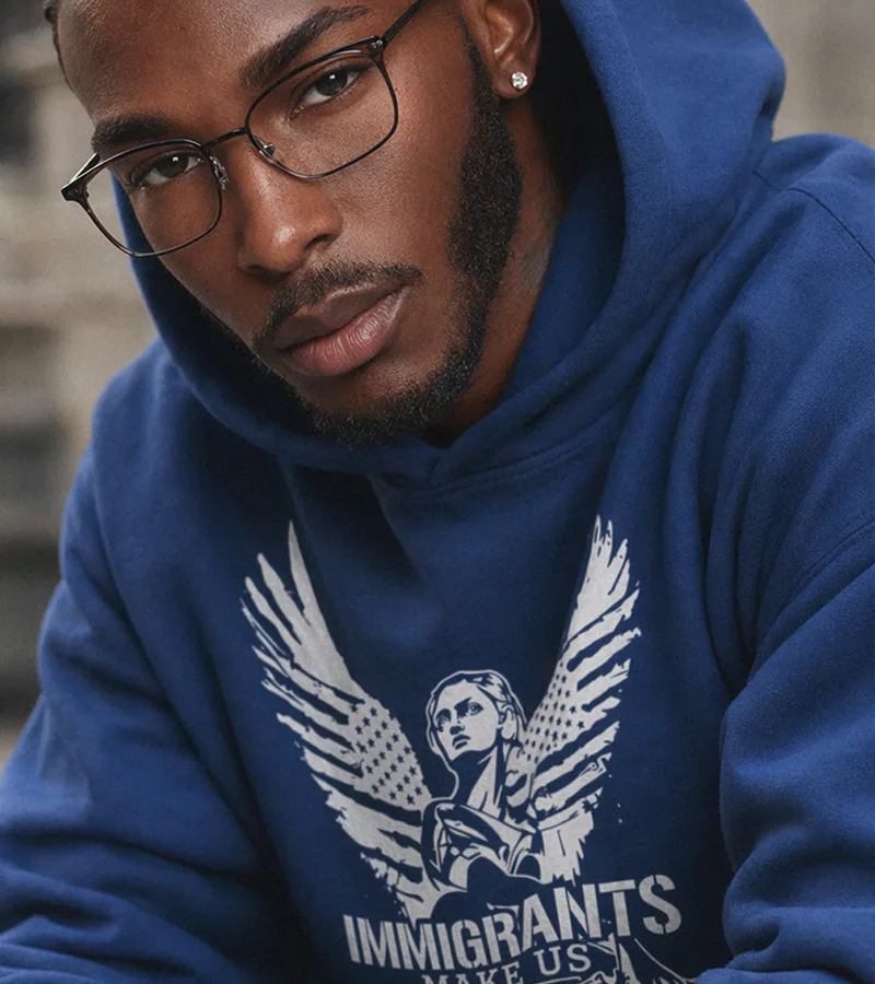 A wearer in the navy Winged Liberty hoodie